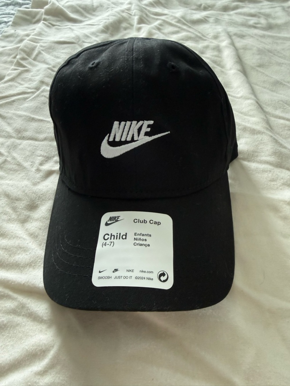 Nike Black Hat with White Tag and Swoosh